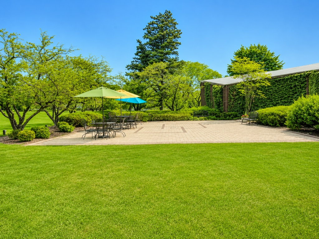 A more distant view of the patio are showing off more of the lawn.